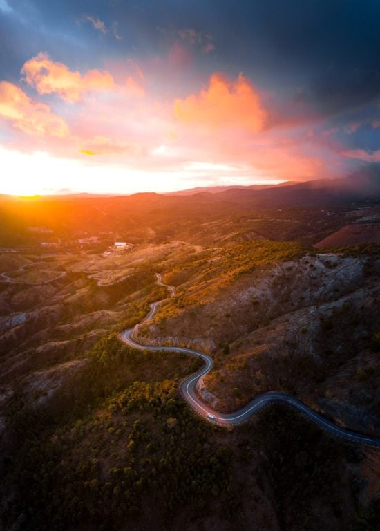 sunset on a winding road in Tasmania