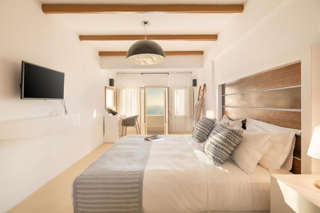 Bedroom with TV and lots of light at Aperion Blue Hotel Santorini