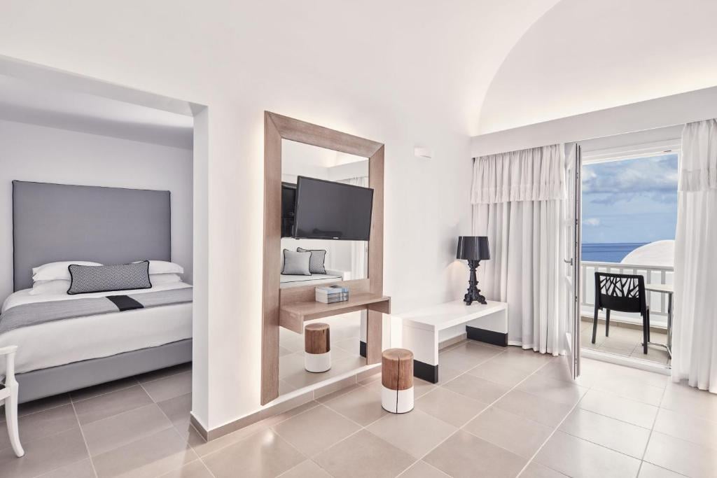 Large bedroom with living space in Fira on Santorini Island at the hotel Aressana Spa