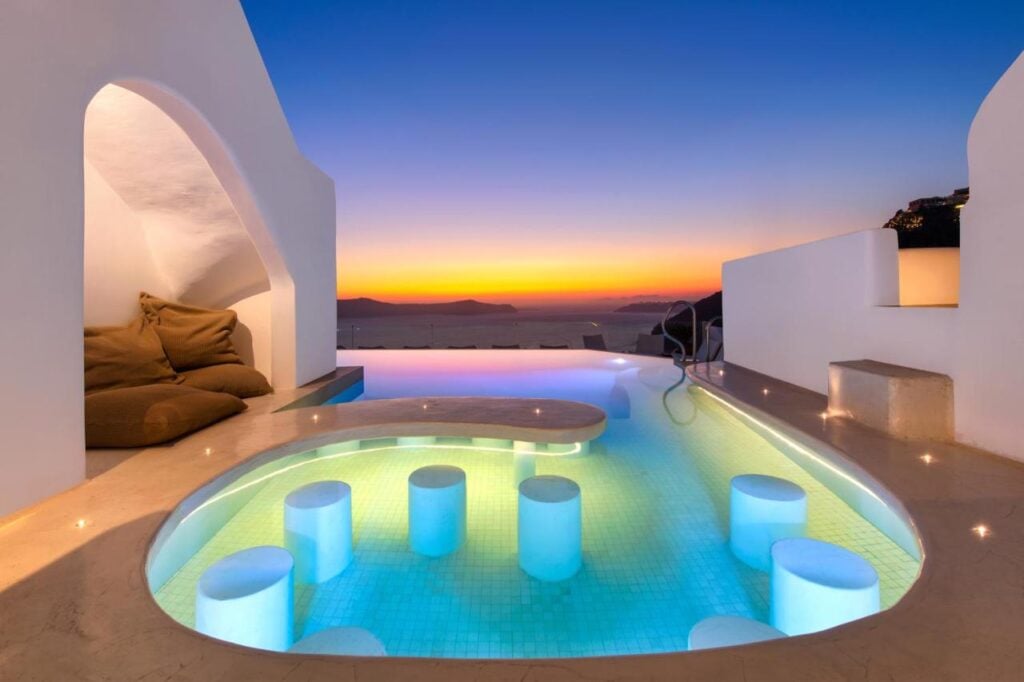 Sunset view at Athina Luxury Hotel with infinity pool with underwater seating