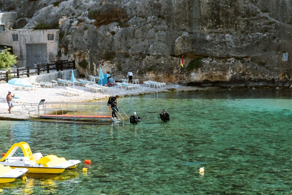 Divers entering the water at Gozo beach
