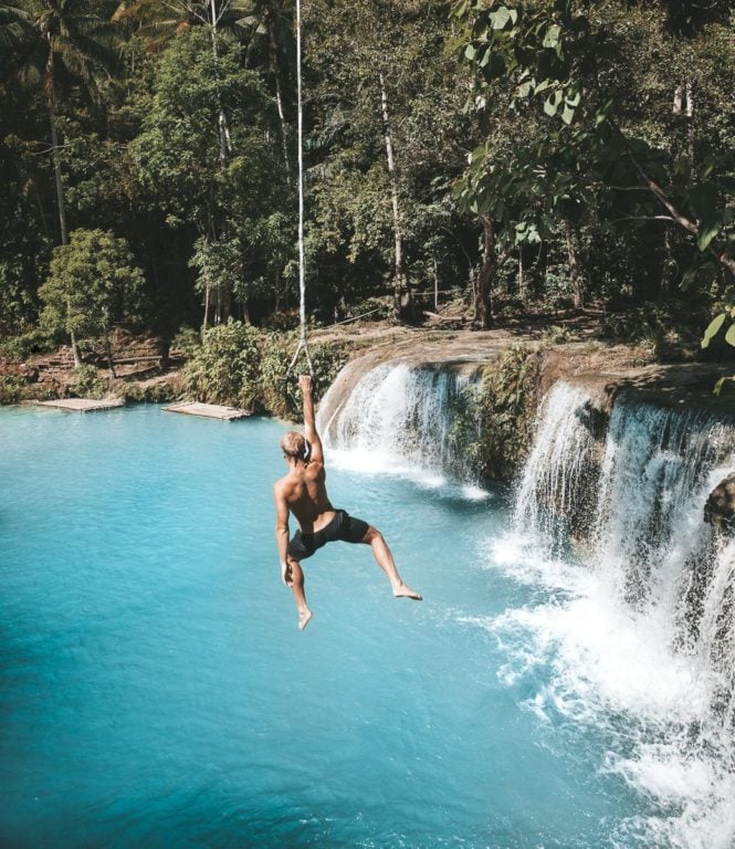 Cambugahay Falls rope swing on Siquijor Island in the Philippines