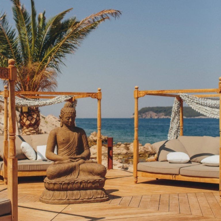 Deck and buddha statue at Coral Beach Bat, Dubrovnik