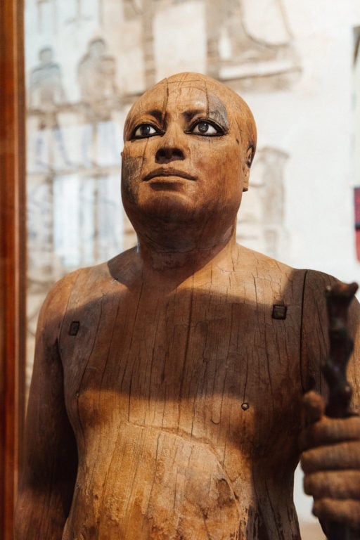 Wooden statue of an ancient Egyptian at the Museum of Cairo