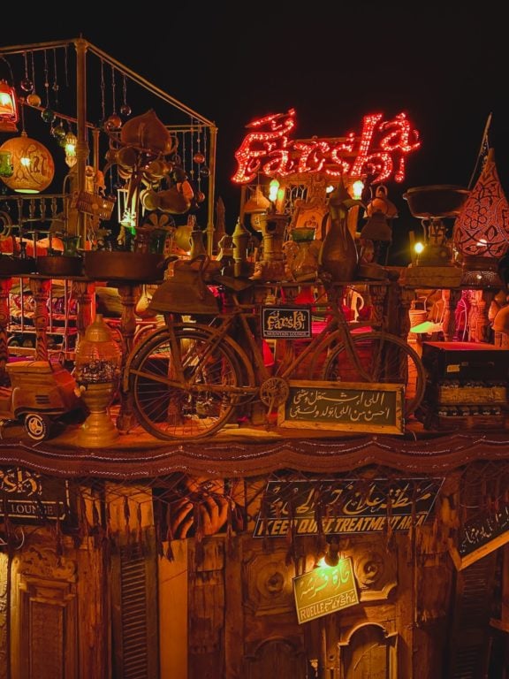 Farsha Cafe decorated with neon lights and antiques