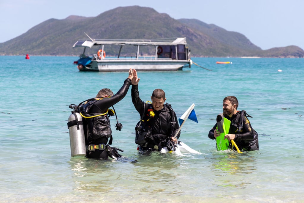 Scuba divers in Welcome Bay