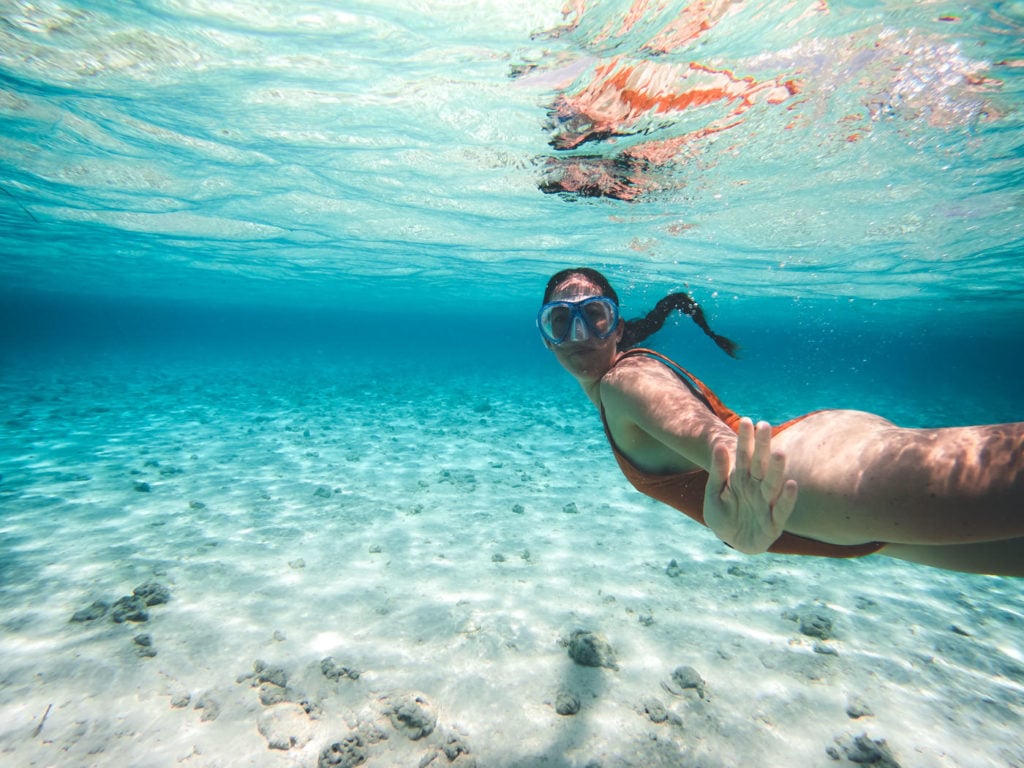 Girl snorkeling in clear water