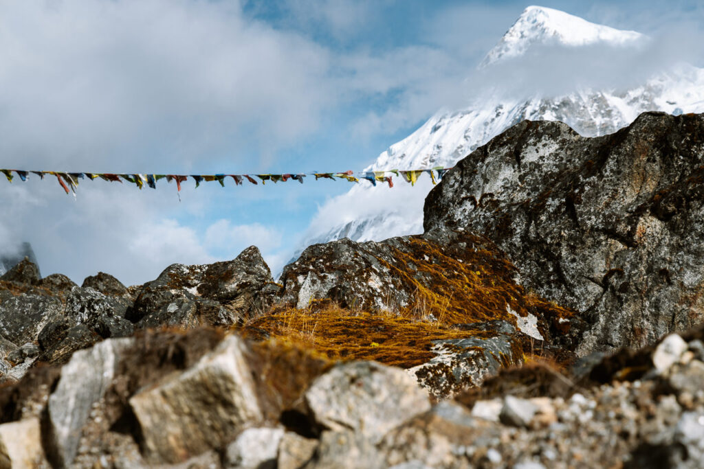View of Prayer Flags and mountains to Rathong Glacier from HMI Base Camp
