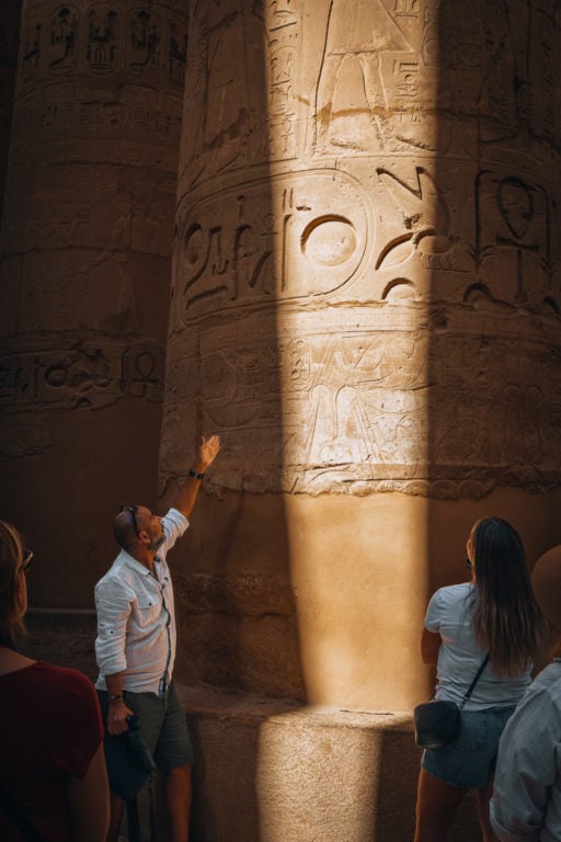 Egyptian Tour Guide explaining important landmark