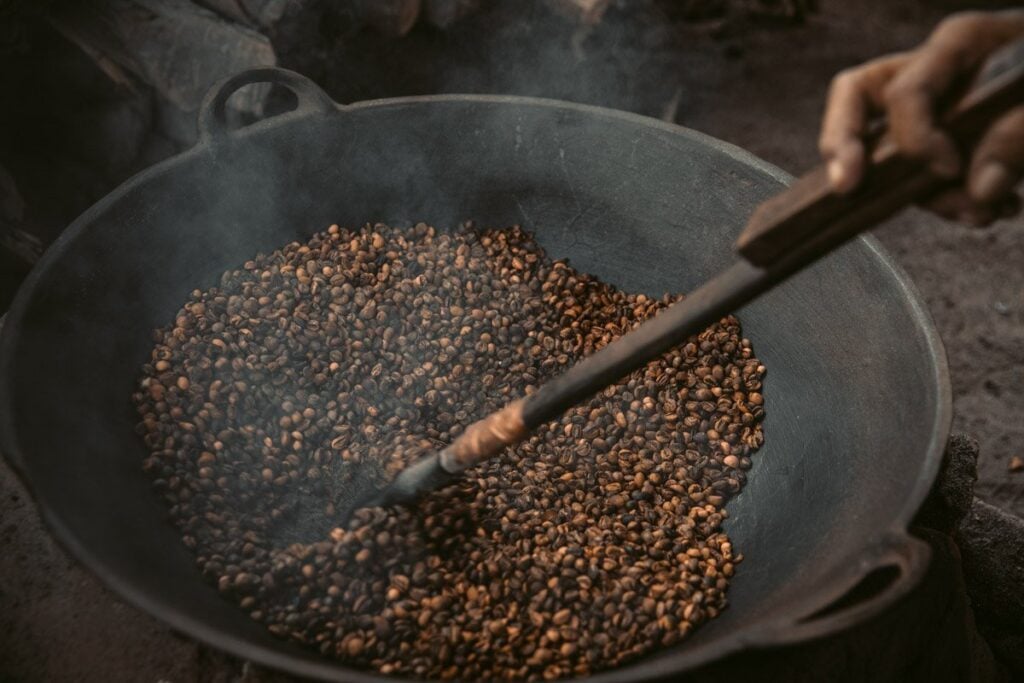 TRADITIONAL COFFEE ROASTING WITH SAND IN LOMBOK INDONESIA