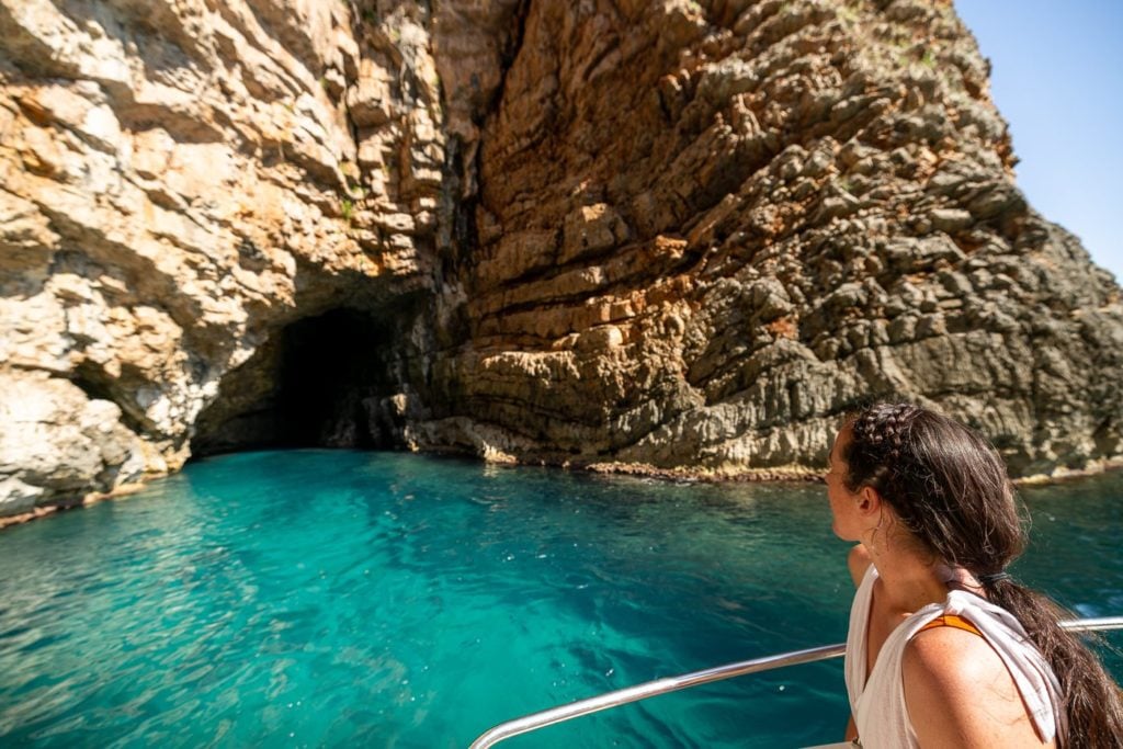 Girl exploring sea caves in Montenegro