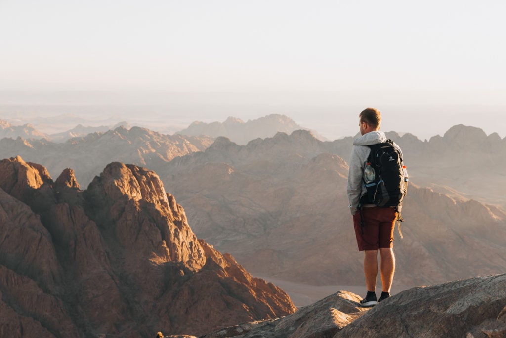 Man standing on top of Mount Sinai, Egypt