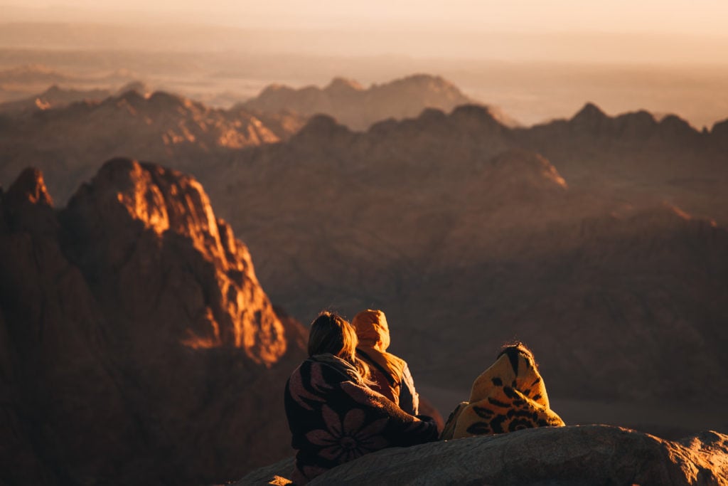 Hikers watching the sunrise at Mount Sinai