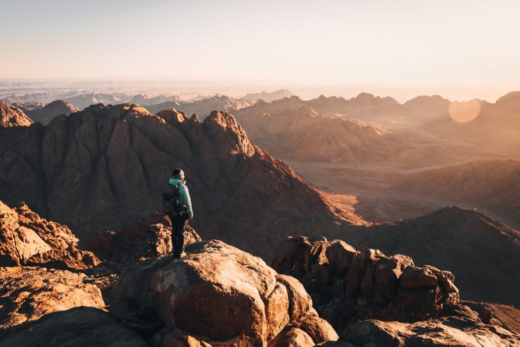 Hiker standing on the summit of Mount Sinai