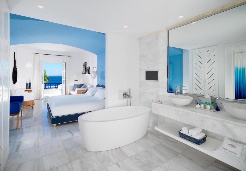 Mykonos Grand Hotel & Resort bedroom and hot tub