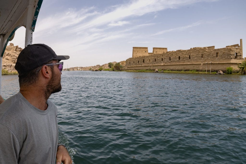 Man staring at Philae Temple in Egypt