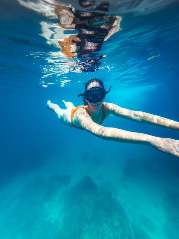 Girl swimming in the Rosario Islands in the Caribbean
