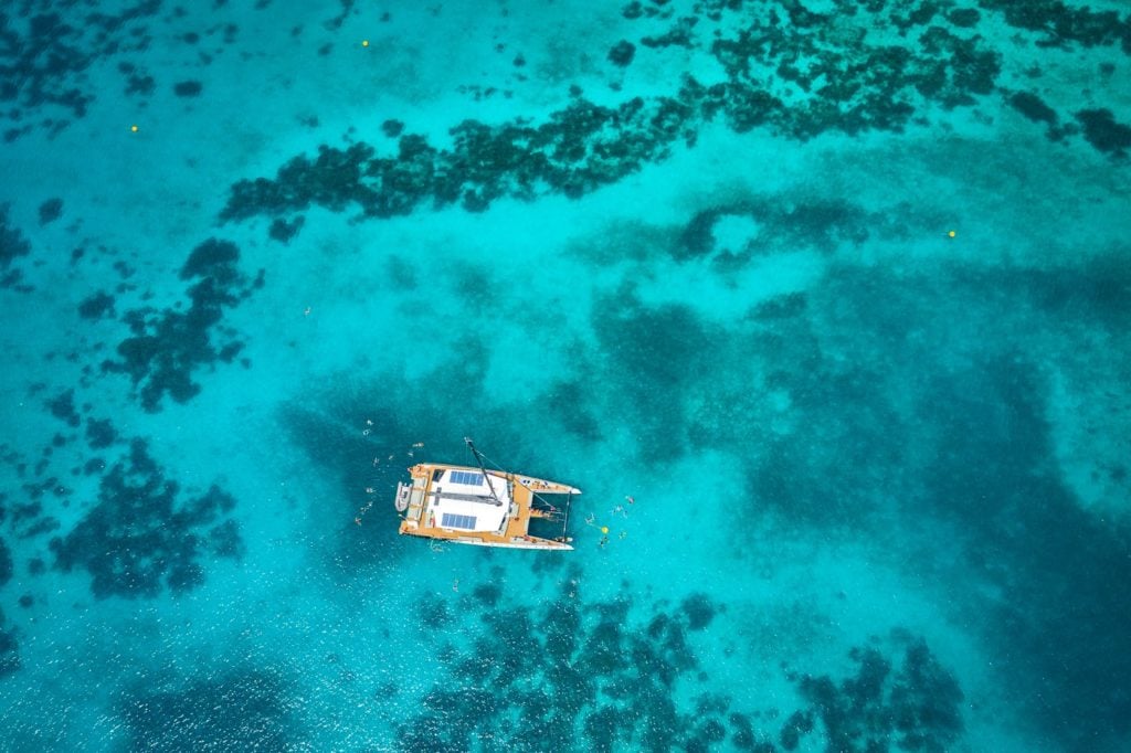Boat and clear water drone photo