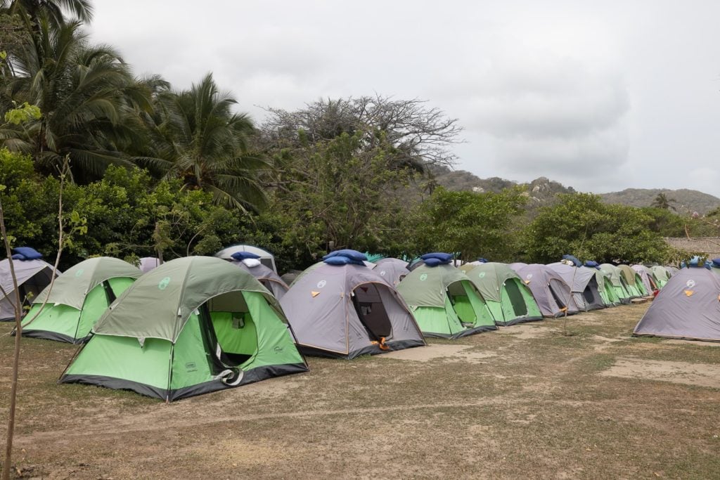 Camping tents at A complete travel guide featuring 10 things to know about visiting Cabo San Juan, Tayrona National Park, Colombia Playa Cabo San Juan del Guía beach