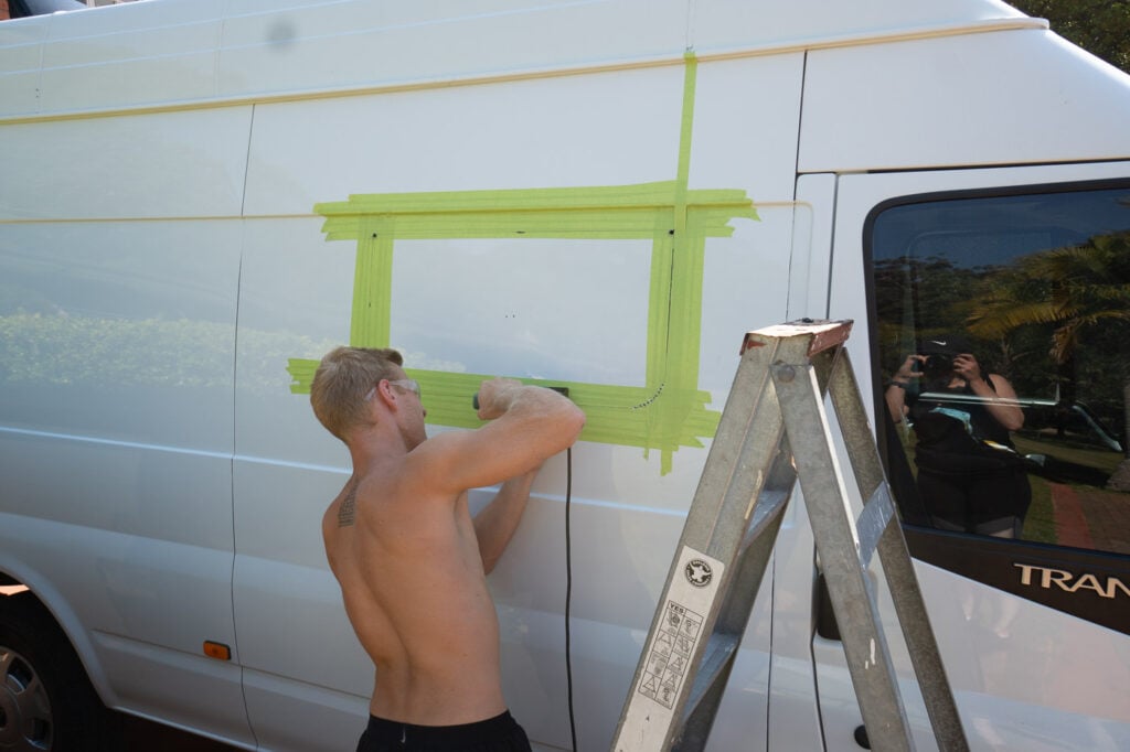 CUTTING A HOLE IN OUR VAN FOR THE WINDOW